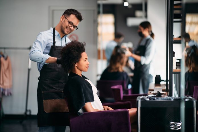 Happy,Male,Hairdresser,Styling,Hair,Of,African,American,Woman,During