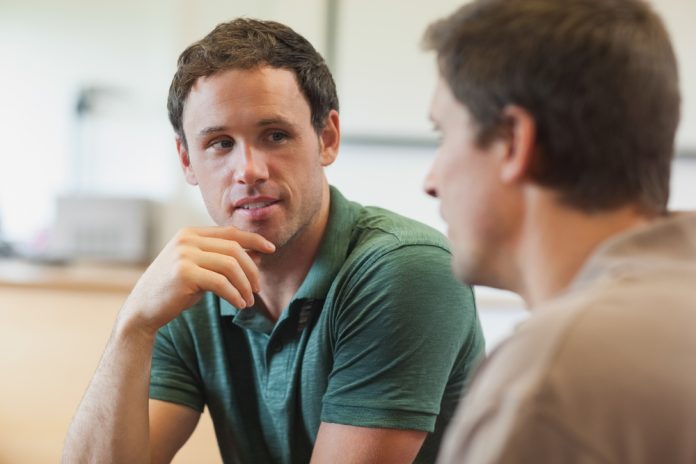 Two,Handsome,Mature,Students,Having,A,Conversation,Sitting,In,Class