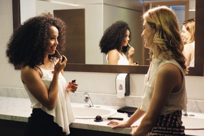Business,People,In,Bathrooms.,Young,Female,Coworkers,As,Friends,Using