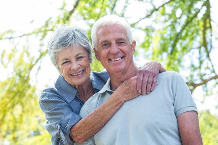 Happy,Old,Couple,Smiling,In,A,Park,On,A,Sunny