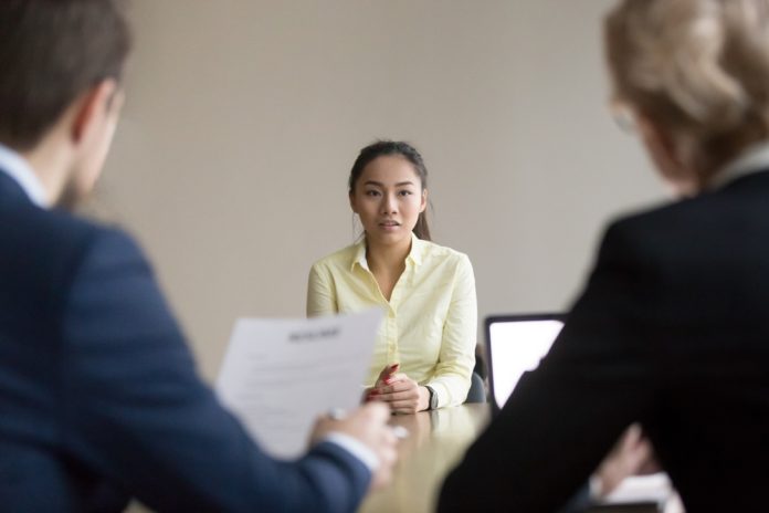 Back,View,Of,Recruiters,Interview,Young,Asian,Job,Candidate,Asking