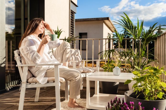 Beautiful,Young,Girl,With,Long,Hair,Relaxing,,Drinking,Tea,And