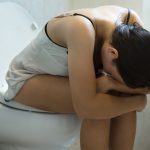 A,Sick,Woman,With,Severe,Pain,In,Her,Stomach,Sitting