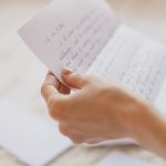 Hands,Of,Young,Woman,Holding,Handwritten,Letter
